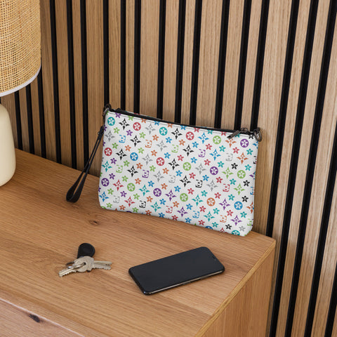 Image of A stylish zippered pouch, the Uncaged "S.U.L.L.I" Crossbody bag from Boss Uncaged Store, on a dresser next to a lamp.