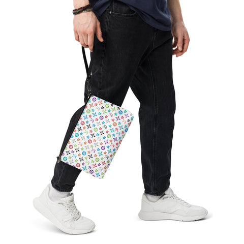Image of A man is holding a stylish "S.U.L.L.I" crossbody bag from Boss Uncaged Store, with a flower pattern, showcasing his fashionable taste.