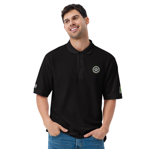 Image of A man wearing a Boss Uncaged Men's Premium Polo shirt with a green logo from the Boss Uncaged Store.