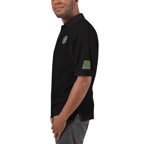 Image of A man wearing a black Boss Uncaged Men's Premium Polo shirt with a green patch from Boss Uncaged Store.