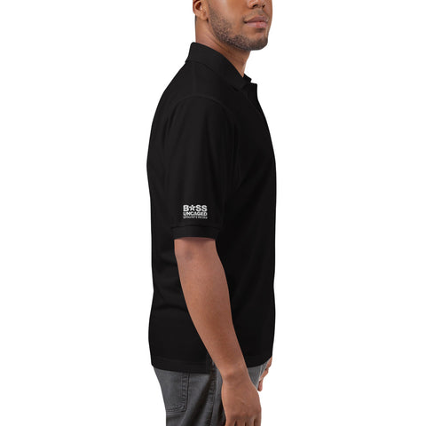 Image of The back of a man wearing a Boss Uncaged Men's Premium Polo shirt from the Boss Uncaged Store.