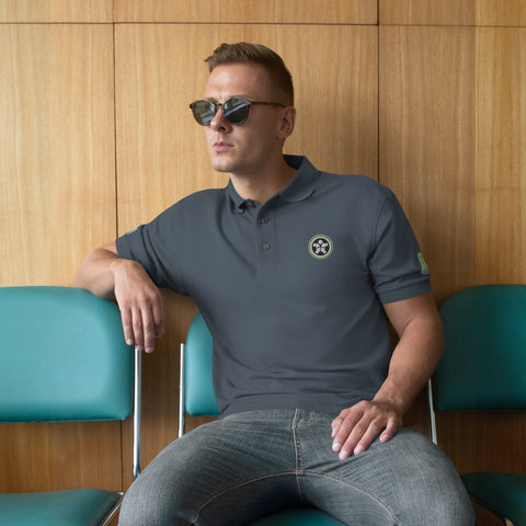 Image of A man sitting in a chair wearing sunglasses and a Boss Uncaged Men's Premium Polo shirt from the Boss Uncaged Store.