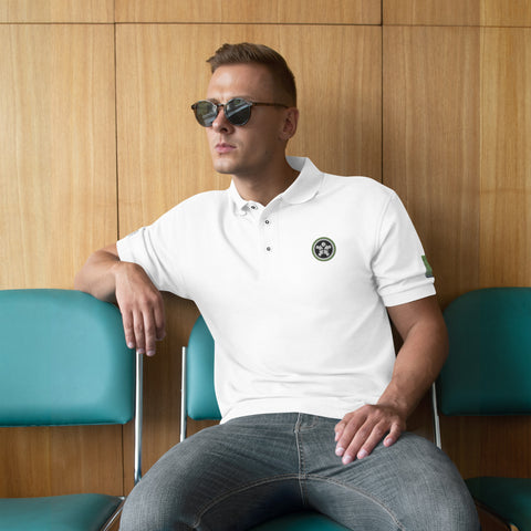 Image of A man in sunglasses sitting on a bench wearing a Boss Uncaged Men's Premium Polo from the Boss Uncaged Store.