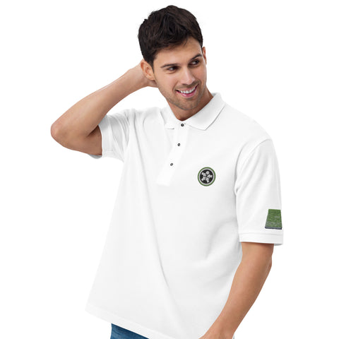 Image of A man wearing a white Boss Uncaged Men's Premium Polo shirt with a green patch from the Boss Uncaged Store.