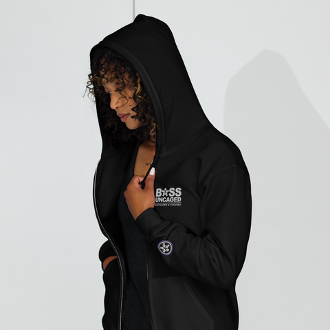 Image of A woman in a black Boss Uncaged Breakthrough Hoodie jacket.