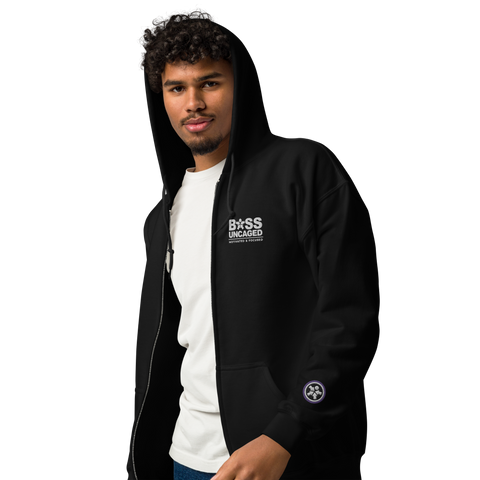 Image of A man wearing a black Boss Uncaged Breakthrough Hoodie with the word boss on it from Boss Uncaged Store.