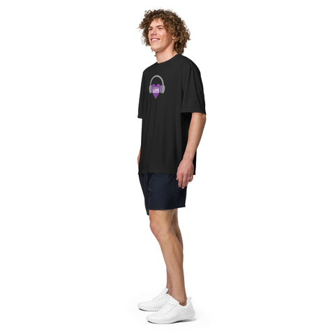 A man wearing an Affirmation I Love Podcasts - Boss Uncaged Unisex performance crew neck t-shirt from the Boss Uncaged Store and purple shorts.