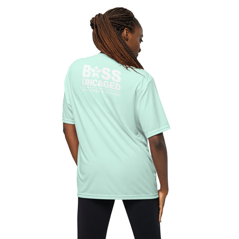 The back view of a woman wearing an Affirmation I Love Podcasts - Boss Uncaged Unisex performance crew neck t-shirt from the Boss Uncaged Store in mint green.