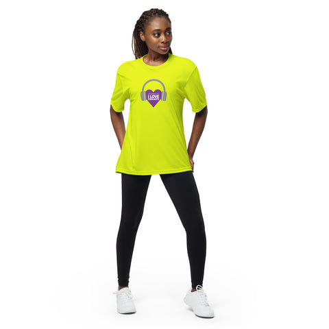 A woman wearing a yellow Affirmation I Love Podcasts - Boss Uncaged Unisex performance crew neck t-shirt and black leggings.
