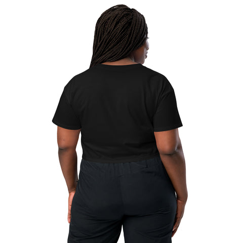 The back view of a woman wearing black pants and an Affirmation I Love Podcasts - Boss Uncaged Store crop top.