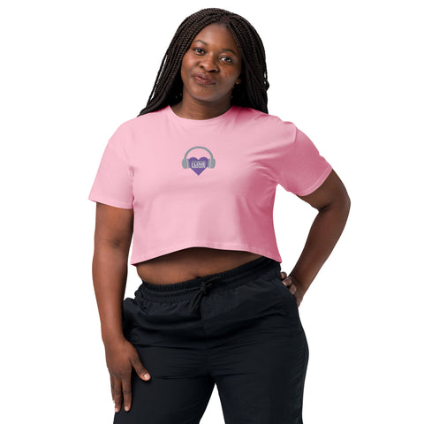 A Boss Uncaged woman rocking an Affirmation I Love Podcasts - Women's crop top while listening to podcasts.