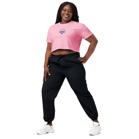 A woman wearing an Affirmation I Love Podcasts - Women’s crop top from Boss Uncaged Store and black joggers.