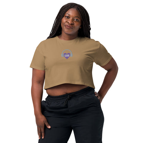 A woman wearing an Affirmation I Love Podcasts - Women’s crop top from Boss Uncaged Store.