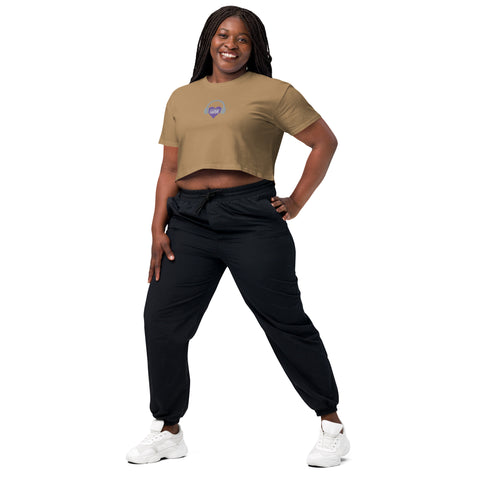 A podcast enthusiast woman confidently rocks an Affirmation I Love Podcasts - Women’s crop top from the Boss Uncaged Store, paired with black joggers, embracing the Boss Uncaged spirit.