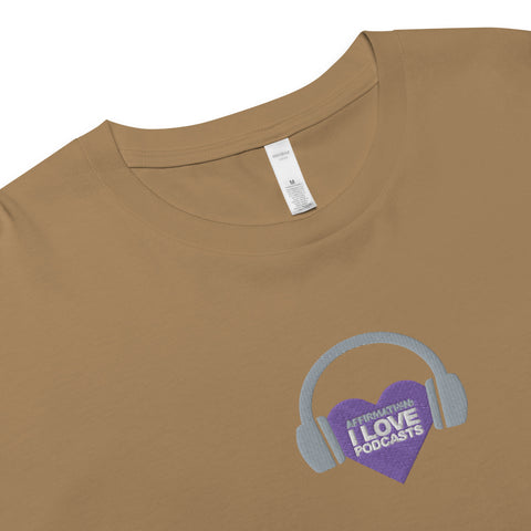A trendy Boss Uncaged Store Affirmation I Love Podcasts Women’s crop top made with combed cotton, featuring a purple heart and headphones.
