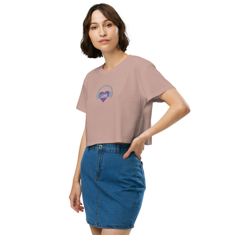 A woman wearing a pink Affirmation I Love Podcasts - Women’s crop top from Boss Uncaged Store.