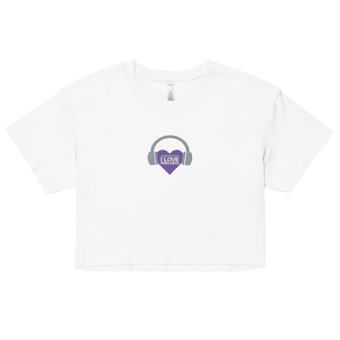 An Affirmation I Love Podcasts - Women’s crop top from the Boss Uncaged Store featuring a purple heart and headphones.