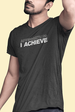 A man wearing a black t-shirt that says Boss Uncaged Store: AFFIRMATION "I ACHIEVE".