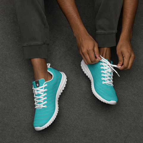 Image of A man tying a pair of Boss Uncaged Workflow Athletic Shoes (Teal) from the Boss Uncaged Store.