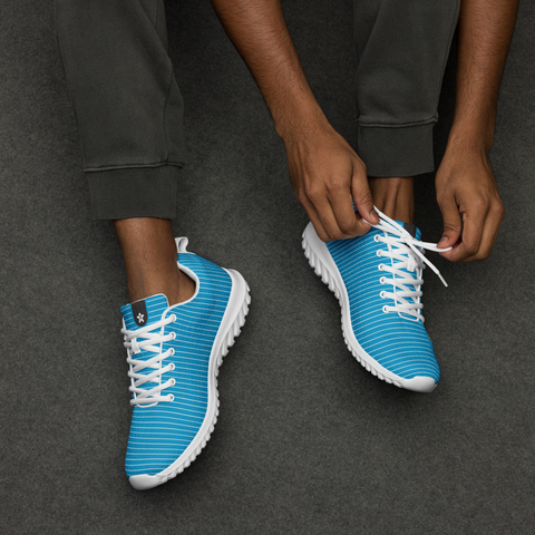 Image of A man tying a pair of Boss Uncaged Workflow Athletic Shoes (Blue) from the Boss Uncaged Store.