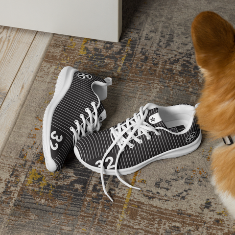 Image of A dog is standing next to a pair of Boss Uncaged Workflow Athletic Shoes (Black) from the Boss Uncaged Store.