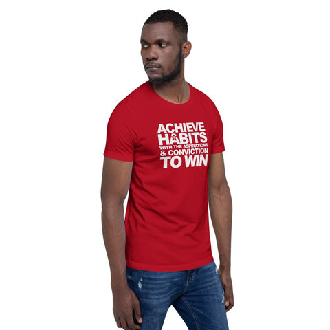 Image of A man wearing a red t-shirt that says "ACHIEVE HABITS WITH THE ASPIRATIONS AND CONVICTION TO WIN" from Boss Uncaged Store.