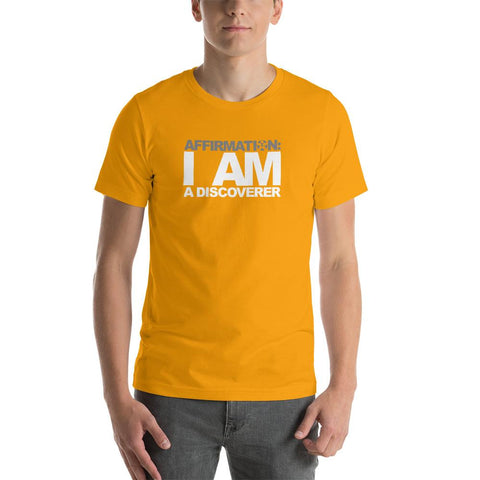 Image of A man wearing an orange t-shirt that says "AFFIRMATION: I AM A DISCOVER" from the Boss Uncaged Store.