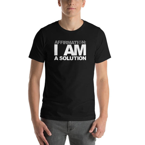 Image of A man wearing a black t-shirt from the Boss Uncaged Store that says "AFFIRMATION: 'I AM A SOLUTION'.
