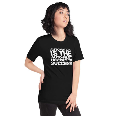 Image of A person with dark hair wearing a black Buteke T-shirt emblazoned with the text "AUTOMATION IS THE AUTO-PILOT ODYSSEY TO SUCCESS" epitomizes the power of task management in streamlining communication.