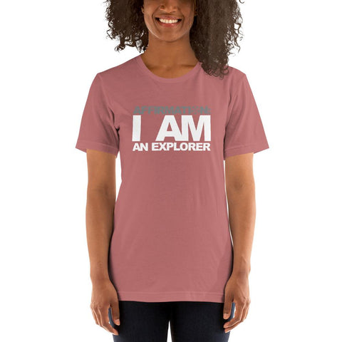 Image of A woman wearing a pink t-shirt that says "AFFIRMATION: I AM AN EXPLORER" from Boss Uncaged Store.