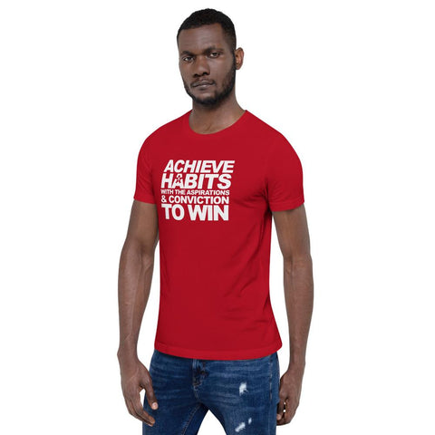 Image of A man wearing a red t-shirt that says "ACHIEVE HABITS WITH THE ASPIRATIONS AND CONVICTION TO WIN" from the Boss Uncaged Store.