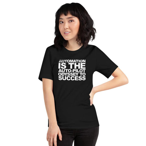 Image of A person sporting shoulder-length dark hair is posing with one hand on their hip while wearing a Buteke black t-shirt that reads "AUTOMATION IS THE AUTO-PILOT ODYSSEY TO SUCCESS" in white, perfectly embodying how automation streamlines communication for ultimate task management success.