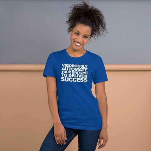 Image of A person stands smiling, wearing a blue t-shirt from Buteke with the text: "VIGOROUSLY AUTOMATE YOUR SYSTEMS TO DELIVER SUCCESS.