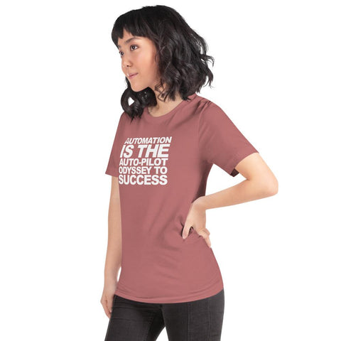 Image of A woman with curly hair stands confidently, wearing a pink Buteke t-shirt that features white text proclaiming "AUTOMATION IS THE AUTO-PILOT ODYSSEY TO SUCCESS." With one hand on her hip, she embodies the spirit of streamlined communication while glancing to the side.