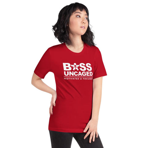 Image of A woman wearing a red t-shirt that says Boss Uncaged Motivated and Focused from the Boss Uncaged Store.