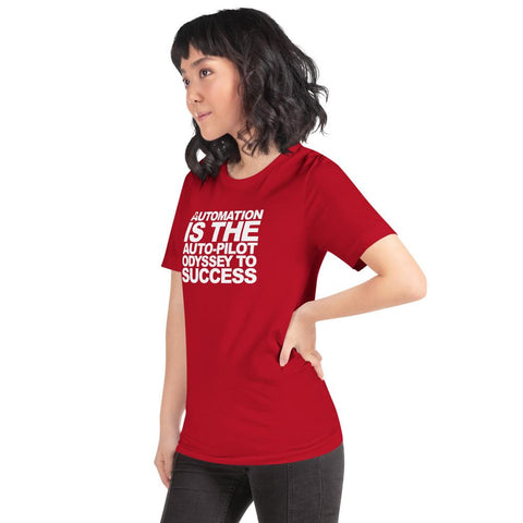 Image of A woman with shoulder-length hair is wearing a red Buteke T-shirt featuring the text "AUTOMATION IS THE AUTO-PILOT ODYSSEY TO SUCCESS" printed in white. She stands with her hand on her hip, looking to the side, embodying the confidence that comes from mastering task management.