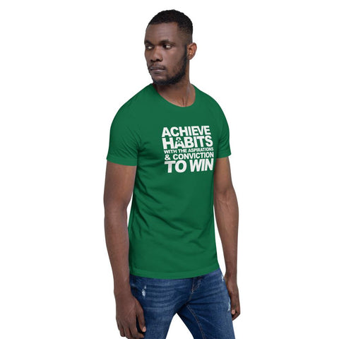 Image of A man wearing a green t-shirt that says "ACHIEVE HABITS WITH THE ASPIRATIONS AND CONVICTION TO WIN." from Boss Uncaged Store fights are the way to win.