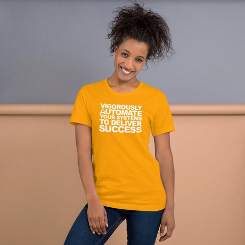 Image of A person with curly hair smiles, donning a yellow Buteke T-shirt emblazoned with the product name “VIGOROUSLY AUTOMATE YOUR SYSTEMS TO DELIVER SUCCESS.” They stand against a two-tone background, embodying the essence of seamless automation.