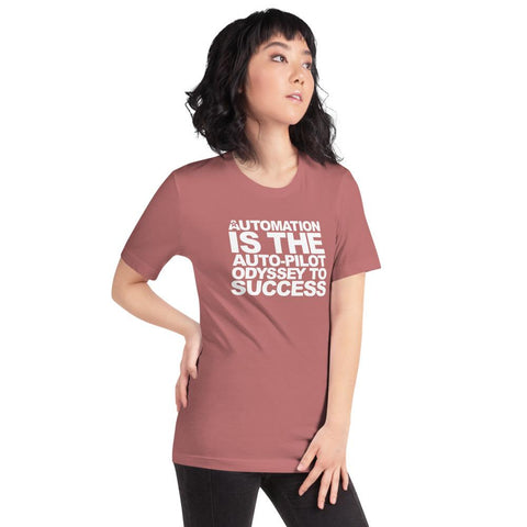 Image of A person with dark hair, dressed in a Buteke pink T-shirt featuring the text "AUTOMATION IS THE AUTO-PILOT ODYSSEY TO SUCCESS," stands against a white background, embodying the essence of streamlined communication and gazing slightly to the left.