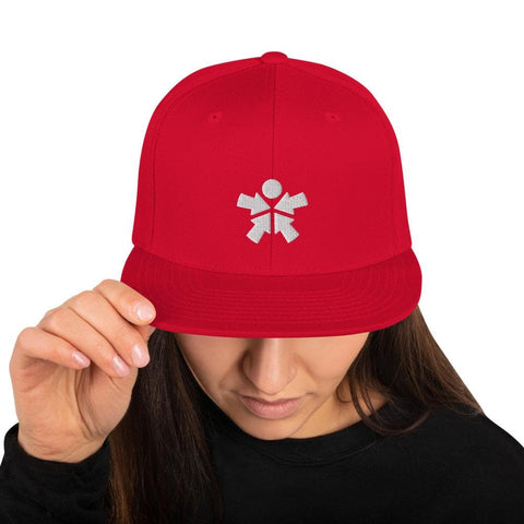 Image of A woman wearing a "Boss Uncaged" snapback hat from the Boss Uncaged Store with a white snowflake on it.