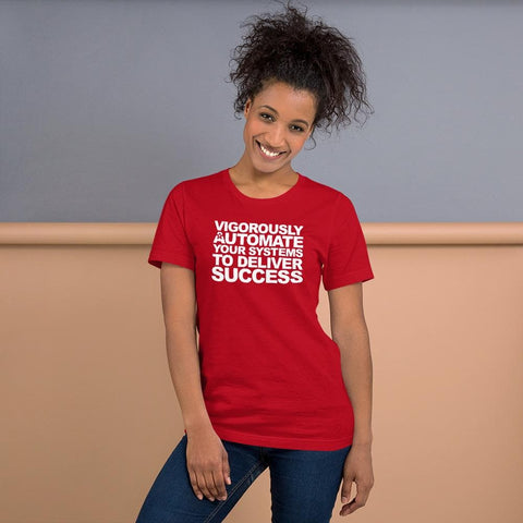 Image of A person with curly hair smiles while wearing a red Buteke T-shirt that says, "VIGOROUSLY AUTOMATE YOUR SYSTEMS TO DELIVER SUCCESS," highlighting the power of Automation.