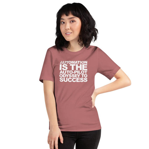 Image of A person wearing a Buteke pink t-shirt featuring the inspirational slogan "AUTOMATION IS THE AUTO-PILOT ODYSSEY TO SUCCESS" printed on the front stands against a plain background, embodying the spirit of streamlined communication and efficient task management.