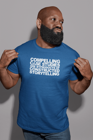 Image of A person with a beard wearing a blue T-shirt from Buteke that reads "Compelling Case Studies Are Byproducts of Constructed Storytelling," highlighting the importance of data.