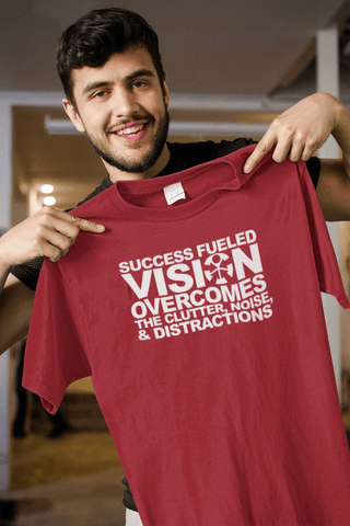 Image of “SUCCESS FUELED VISION OVERCOMES THE CLUTTER, NOISE, AND DISTRACTIONS”	-