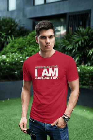 A man wearing a red t - shirt that says, "AFFIRMATION: 'I AM A RECRUITER'" from Boss Uncaged Store.