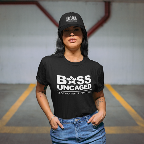 Image of A woman wearing a black t-shirt that says "Boss Uncaged Motivated and Focused" from the Boss Uncaged Store.
