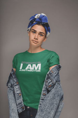 A woman wearing a green t-shirt that says "AFFIRMATION: I AM A DISTRIBUTOR" from Boss Uncaged Store.